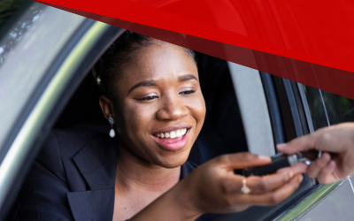smiling woman being handed her car keys=